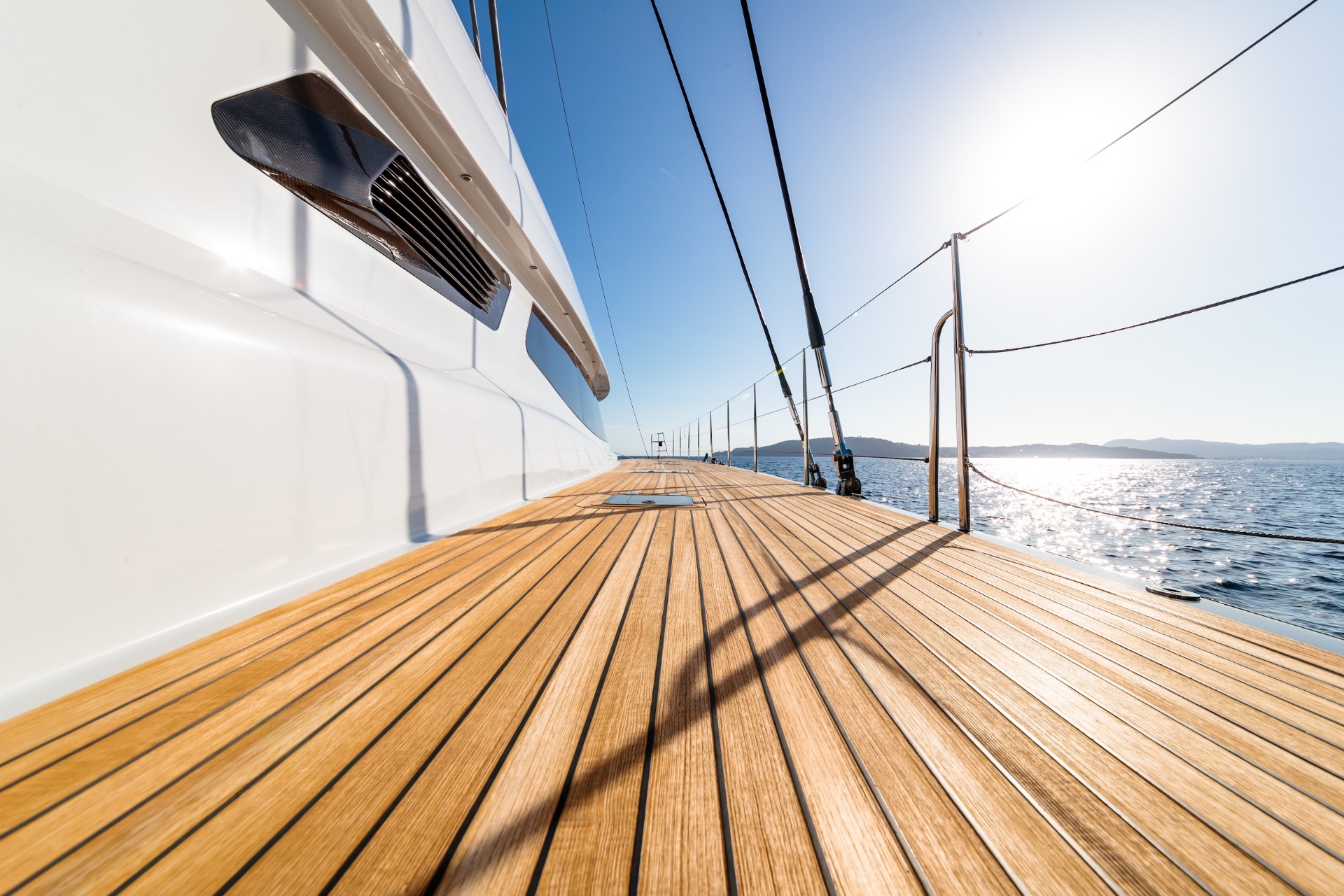 Teak deck of a luxury yacht looking toward the horizon